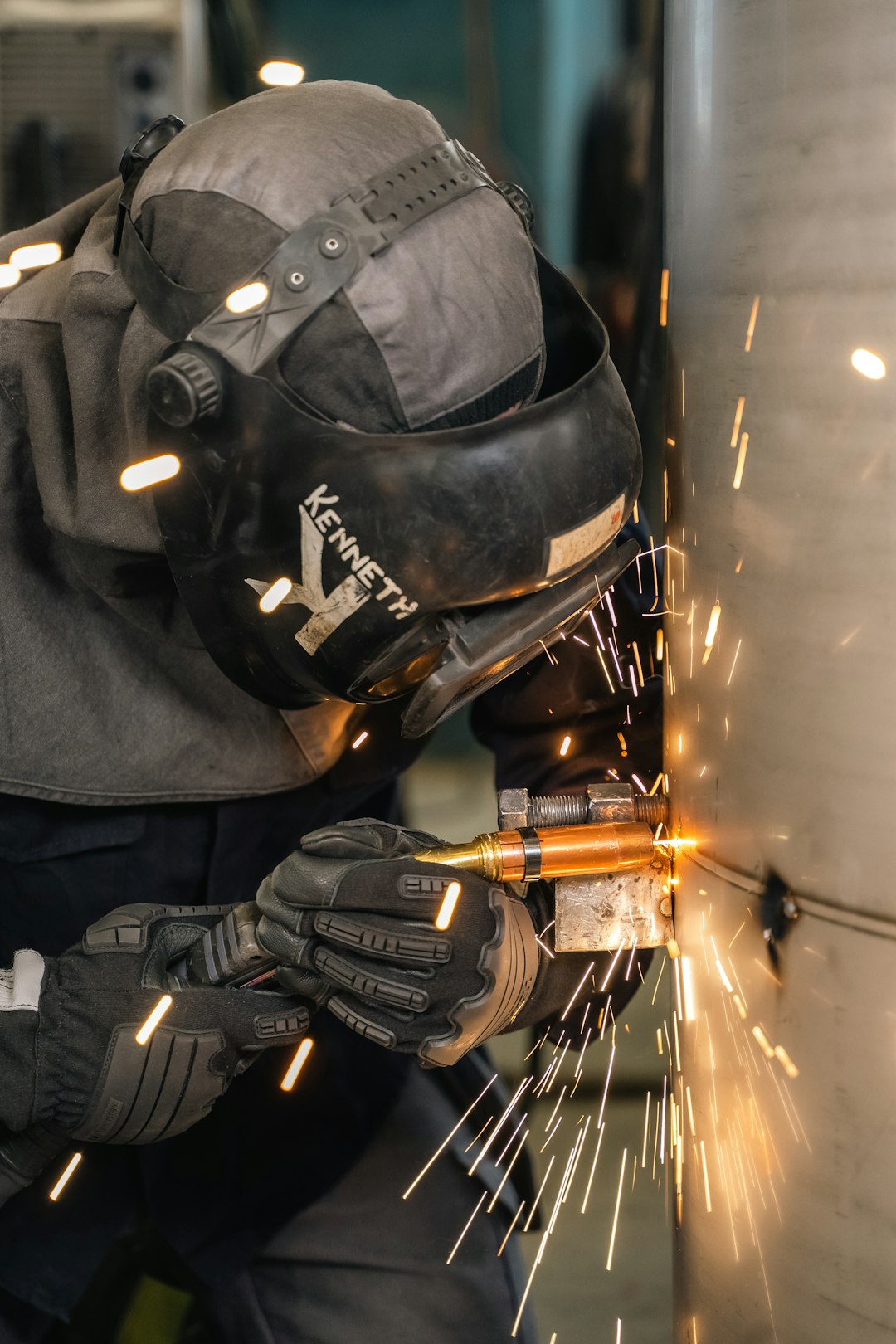 A welder is welding.